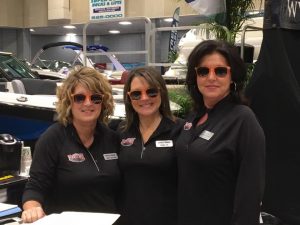 ladies at boat show with sunglasses on