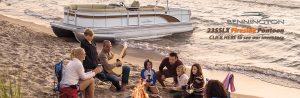 Bennington - 23SSLX on beach with family beside the fire with guitar