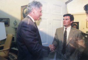 Owner shaking Bill Clinton's hand